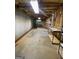 This basement has cement floors, exposed ceiling, and shelves to use for storage at 2142 E Atlanta Rd, Stockbridge, GA 30281