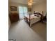 Cozy bedroom with vintage furniture, neutral carpet, and bright window at 2142 E Atlanta Rd, Stockbridge, GA 30281