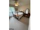 A cozy bedroom is decorated with an antique wooden bed frame and furniture at 2142 E Atlanta Rd, Stockbridge, GA 30281