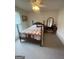 A cozy bedroom is decorated with an antique wooden bed frame and furniture at 2142 E Atlanta Rd, Stockbridge, GA 30281
