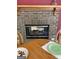 Close up of the breakfast nook showing the brick fireplace and table setting at 2142 E Atlanta Rd, Stockbridge, GA 30281