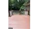 This backyard deck is made of wood and features white wood railings and a lush green lawn at 2142 E Atlanta Rd, Stockbridge, GA 30281