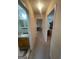 A clean hallway with neutral carpet leadings to other rooms in the home at 2142 E Atlanta Rd, Stockbridge, GA 30281