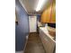 Laundry room with washer, dryer, utility sink, and storage cabinets at 2142 E Atlanta Rd, Stockbridge, GA 30281