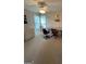 A carpeted room with great natural light, chairs, and tables at 2142 E Atlanta Rd, Stockbridge, GA 30281