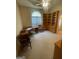 Home office featuring built-in bookshelves, a desk, and neutral carpet at 2142 E Atlanta Rd, Stockbridge, GA 30281