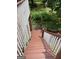 These wooden stairs feature wood and white railings that lead to a private backyard at 2142 E Atlanta Rd, Stockbridge, GA 30281