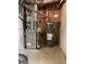 Water heater and furnace in an unfinished utility area of the basement at 2142 E Atlanta Rd, Stockbridge, GA 30281