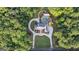 A beautiful luxury estate seen from an aerial view, boasting a circular driveway and well manicured lawn at 1385 Gordon Rd, Moreland, GA 30259