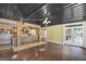 Entertaining bar area with rustic wooden bar, exposed brick, and large open space at 1385 Gordon Rd, Moreland, GA 30259