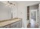Well-lit bathroom with granite countertop, stylish vanity, and access to a bathtub at 1385 Gordon Rd, Moreland, GA 30259