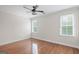 Bright bedroom featuring hardwood floors and two large windows with natural light at 1385 Gordon Rd, Moreland, GA 30259