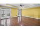 Bright Bonus Room featuring hardwood floors, ceiling fan, recessed lights, and french doors at 1385 Gordon Rd, Moreland, GA 30259