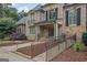 Elegant home exterior with brick and stone facade, accessible ramp, and well-manicured landscaping at 1385 Gordon Rd, Moreland, GA 30259