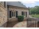 Stylish brick home with complementary stonework, black shutters, and a curved stone walkway at 1385 Gordon Rd, Moreland, GA 30259