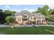 Beautiful home with a manicured lawn, mature trees, and a fenced front yard for added privacy at 1385 Gordon Rd, Moreland, GA 30259