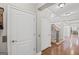 Foyer with hardwood floors and staircase with wood and wrought iron railings at 1385 Gordon Rd, Moreland, GA 30259