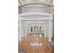 Elegant foyer with hardwood floors, soaring ceilings, and a view of the second-floor balcony at 1385 Gordon Rd, Moreland, GA 30259