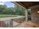Scenic view from the front porch showcasing the expansive driveway and lush greenery at 1385 Gordon Rd, Moreland, GA 30259