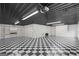 Spacious garage featuring a black and white checkered floor and ample storage space at 1385 Gordon Rd, Moreland, GA 30259