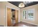 Bright living room with a fireplace, large windows and views of the swimming pool at 1385 Gordon Rd, Moreland, GA 30259