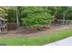 Well-equipped backyard playground offering a variety of activities, set against a wooded backdrop at 1385 Gordon Rd, Moreland, GA 30259