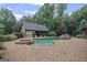 Backyard pool with a built-in hot tub and a pool house providing a perfect outdoor retreat at 1385 Gordon Rd, Moreland, GA 30259
