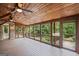Large covered porch overlooking a lush green backyard at 1385 Gordon Rd, Moreland, GA 30259