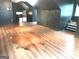 Spacious finished attic featuring hardwood floors and natural light at 130 Victoria Pl, Fayetteville, GA 30214