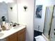 Bathroom featuring dual sinks, decorative walls, framed mirror, and a walk-in shower at 130 Victoria Pl, Fayetteville, GA 30214