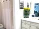 Clean bathroom with flowers, decor, and a shower with curtain at 130 Victoria Pl, Fayetteville, GA 30214