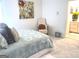 Bright bedroom features a comfortable chair and an ensuite bathroom at 130 Victoria Pl, Fayetteville, GA 30214