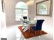 Bright dining area features a glass table, unique chairs, and crystal chandelier at 130 Victoria Pl, Fayetteville, GA 30214