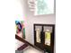 Foyer with a modern chandelier and elegant double-door entryway, featuring an art piece at 130 Victoria Pl, Fayetteville, GA 30214