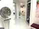 Bright hallway boasts modern decor, sleek tile floors, and elegant accents at 130 Victoria Pl, Fayetteville, GA 30214