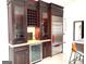 Elegant bar area with a wine cooler, custom cabinets, and stainless steel refrigerator at 130 Victoria Pl, Fayetteville, GA 30214