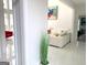 Bright and airy living room with white marble floors and contemporary furnishings at 130 Victoria Pl, Fayetteville, GA 30214