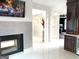 Living room with a fireplace, modern tile work, and view to the hallway at 130 Victoria Pl, Fayetteville, GA 30214