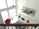 Bright living room boasts high ceilings, modern art, and comfortable white seating at 130 Victoria Pl, Fayetteville, GA 30214