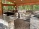 Well-equipped outdoor kitchen with modern appliances and a spacious counter at 130 Victoria Pl, Fayetteville, GA 30214