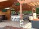 Extensive outdoor kitchen with stone counters, bar seating, and stainless steel appliances at 130 Victoria Pl, Fayetteville, GA 30214