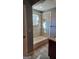 Updated bathroom features ceramic tile, a bathtub, and a built-in niche for storage at 615 Cofield Dr, Hapeville, GA 30354