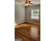 Bright bedroom with hardwood floors, ceiling fan, and natural light, offering a comfortable and welcoming space at 615 Cofield Dr, Hapeville, GA 30354