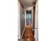Hallway featuring hardwood floors and access to other rooms at 615 Cofield Dr, Hapeville, GA 30354