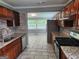 Updated kitchen featuring granite countertops, stainless steel appliances, and tiled backsplash at 615 Cofield Dr, Hapeville, GA 30354