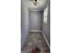 A simple laundry room with tiled floors and grey walls at 615 Cofield Dr, Hapeville, GA 30354