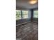 Sunlit living room featuring tiled floors and bright natural light at 615 Cofield Dr, Hapeville, GA 30354