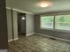 A spacious living room offers ample light and tiled floors at 615 Cofield Dr, Hapeville, GA 30354