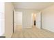Bedroom with neutral carpet and white walls, featuring doorways to a bathroom and closet at 504 Alford Cv # 90, Fairburn, GA 30213