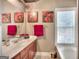 Bathroom with cherry-stained vanity, decorative painting and a bathtub at 2804 Dominion Nw Ln # Bldg 2, Kennesaw, GA 30144